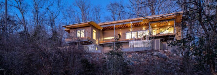 Distinctly modern net-zero home sits in harmony with its woodland surroundings