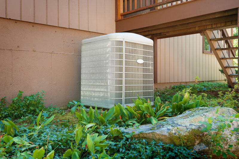 Here are three creative ways to disguise your outdoor heat pump unit